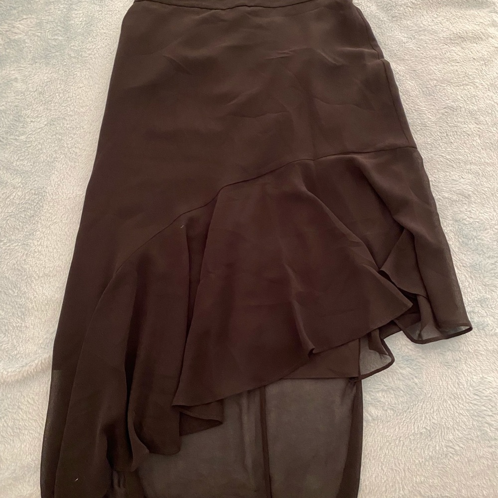 Black asymmetrical skirt.
